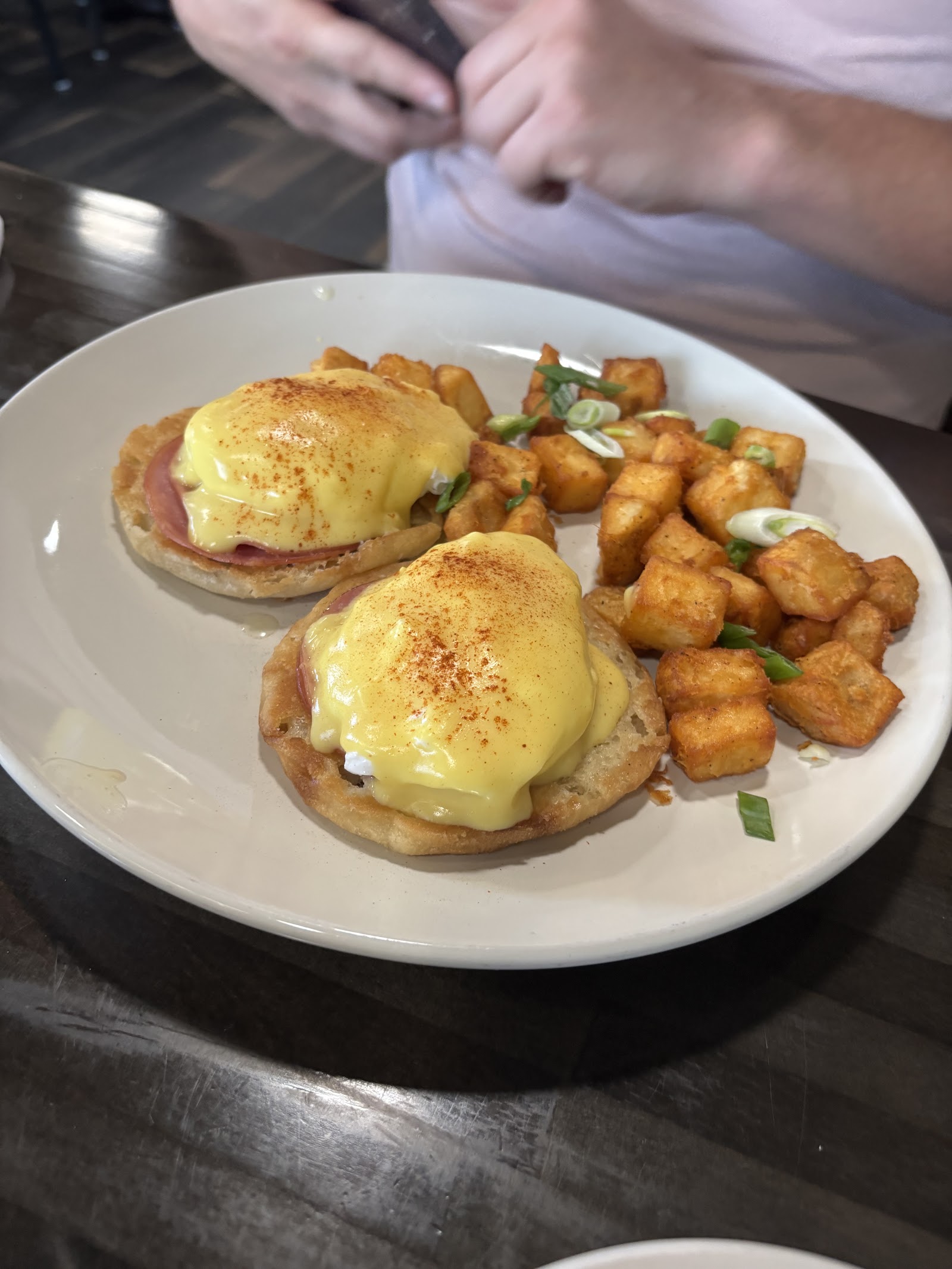 Classic eggs Benedict with crispy breakfast potatoes